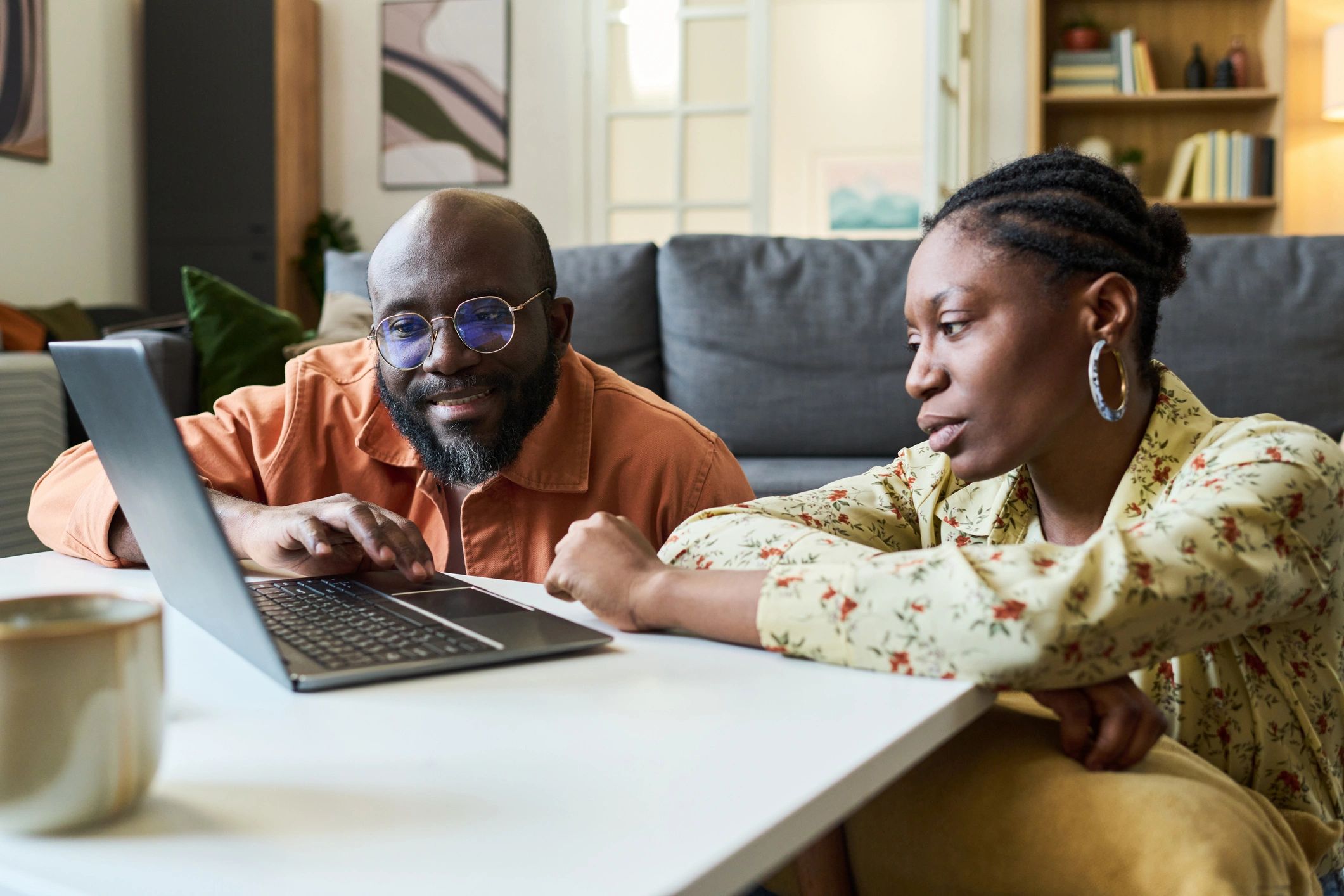 Couple engaging together in an online session from home